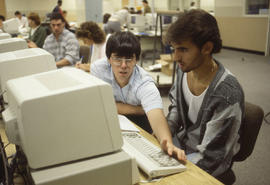 Photograph of students working in a personal computer lab
