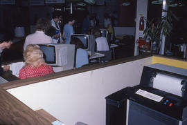 Photograph of staff testing the computer system changes