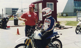 Photograph of Someone Being Trained on a Motorcycle
