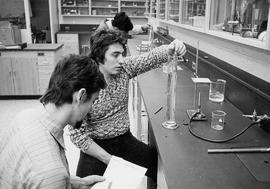Photograph of a Chemistry Students Doing An Experiment In The Lab