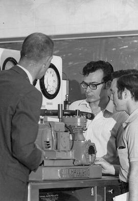 Photograph of a Faculty Member Explaining to Students of the Heating Regulator in the Mechanical Lab