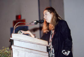 Photograph of Ann Beattie standing at the podium