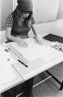 Photograph of a Design Student Working on a Drawing