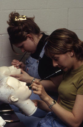 A photograph of two Funeral Services students and their mannequins