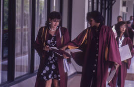 Photograph of Graduates Walking Down the Hall