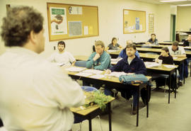 A photograph of a professor lecturing students