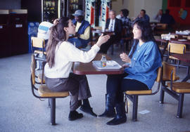 Photograph of two students in the Kites Cafeteria