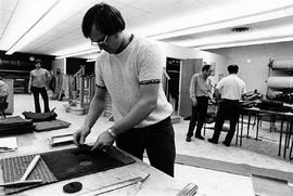 Photograph of Students Learning Floor Covering in the Carpeting Lab