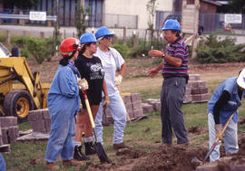 Photograph of groundskeeping crew preparing to start their work