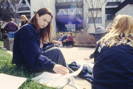 A photograph of students working on assignments outdoors