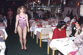 Photograph of a fashion model in a dining room