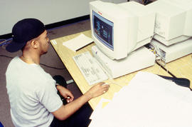 photograph of a student working on assignment at the computer