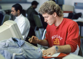 Photograph of a student working at a computer