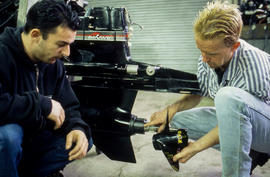 Photograph of Robert Smith and student working in the Small Engine Repair lab