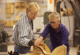Photograph of faculty and student working on a woodworking project