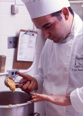 Photograph of a Culinary program student in the kitchen