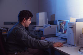 Photograph of student staff digitally editing a photograph