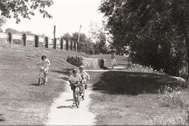 Photograph of children riding their bikes in a Lakeshore park