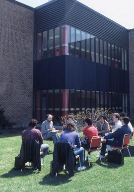 Photograph of an Instructor teaching class outside of J building