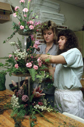 Photograph of students working on a floral arrangement