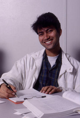 Photograph of a student at work on note taking