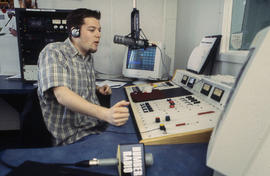Photograph of a student in the Humber radio broadcasting studio