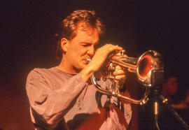 Photograph of a student musician playing an instrument