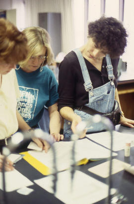 Photograph of three students working in a lab at North Campus