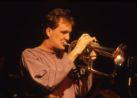 Photograph of a student musician playing a flugelhorn