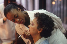Photograph of a makeup artist and client