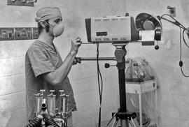 Photograph of a Student Filming a Medical Operation on a Horse in the Equine Centre