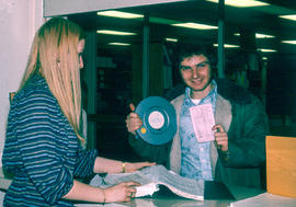 Photograph of a Student Getting Served at the Service Counter in the LRC