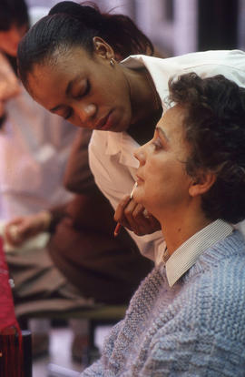 Photograph of a student applying makeup