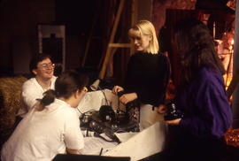 Photograph of Theatre students on set amid discussions