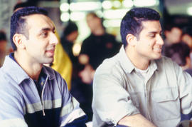 Photograph of two students sitting in an unknown location