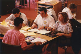 Photograph of  a group studying at the library