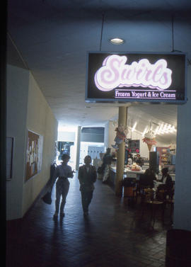 Photograph of signage for Swirls Frozen Yogurt & Ice-Cream counter
