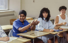 Photograph of students practicing sign language in class