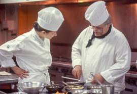 Photograph of Frank Formella and a culinary student in the kitchen
