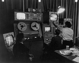 Photograph of Technicians Monitoring Television Equipment at the IMC
