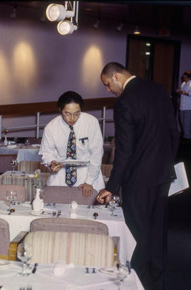 Photograph of faculty member and students in the Humber Room