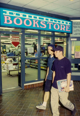 Photograph of two students walking by the Bookstore