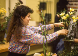 Photograph of a student arranging a flower display