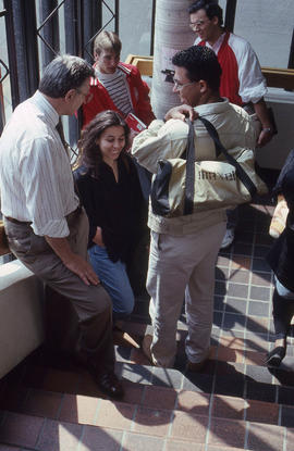 Photograph of instructor, John Maxwell with a group of students