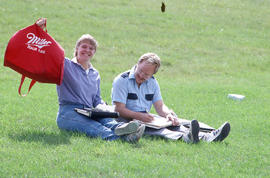 Photograph of students sitting in the grass