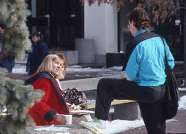 Photograph of students sitting in the courtyard