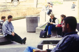 A photograph of students sitting outside