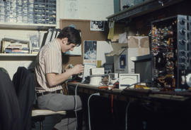 Photograph of Gary Hetherington Working on a Workbench in the IMC