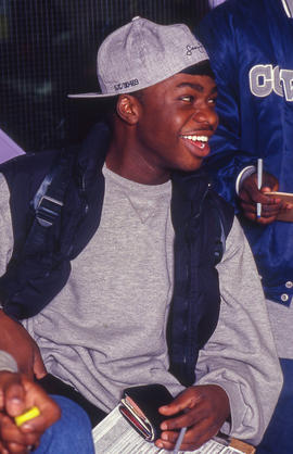 Photograph of a student seated with friends