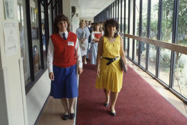 Photograph of students walking the hallway of D building